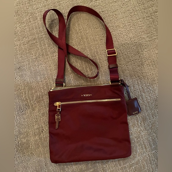 Tumi Handbags - EUC Tumi Voyager Burgundy Crossbody with Gold Hardware,